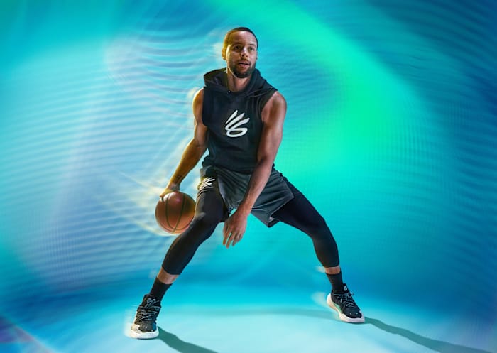 Stephen Curry dribbles a basketball in an Under Armour photo shoot.